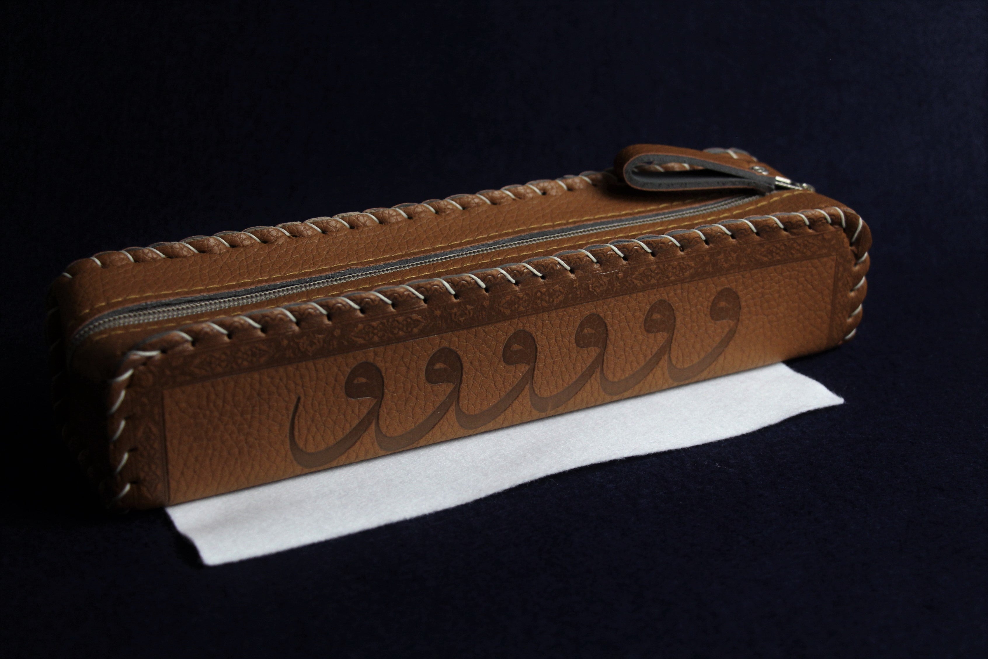 Faux leather case decorated with Arabic calligraphy - brown