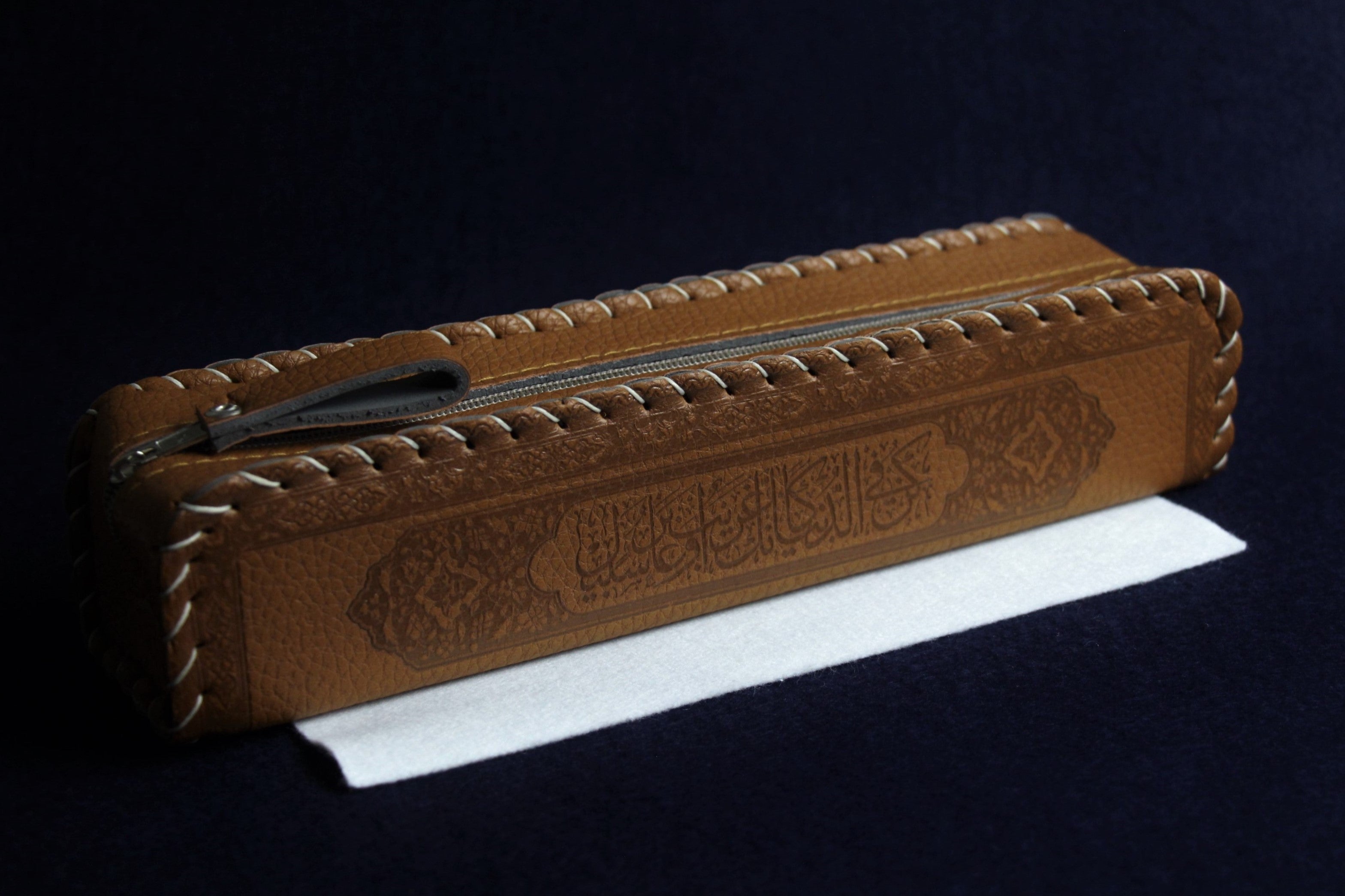 Faux leather case decorated with Arabic calligraphy - brown