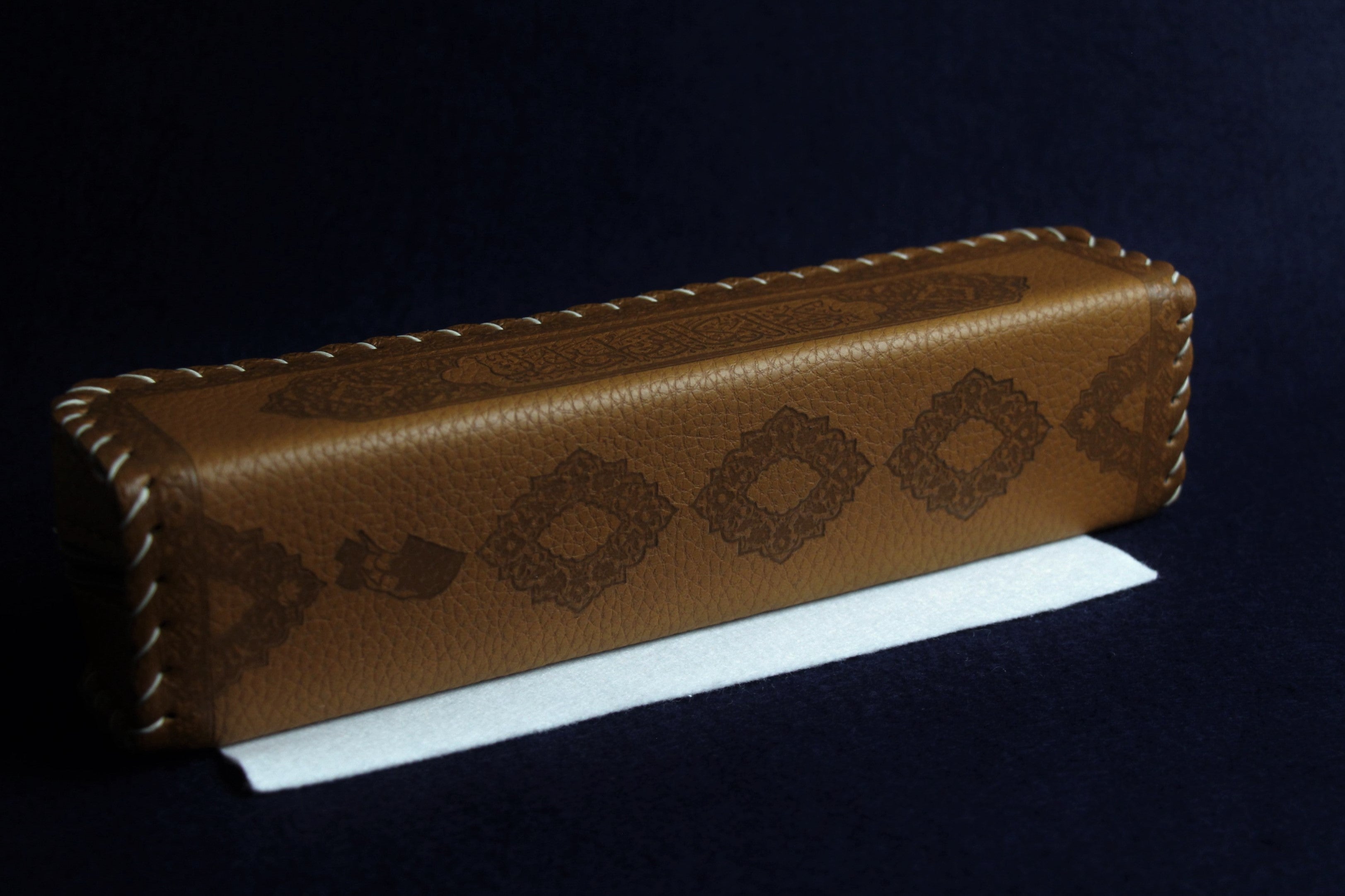 Faux leather case decorated with Arabic calligraphy - brown