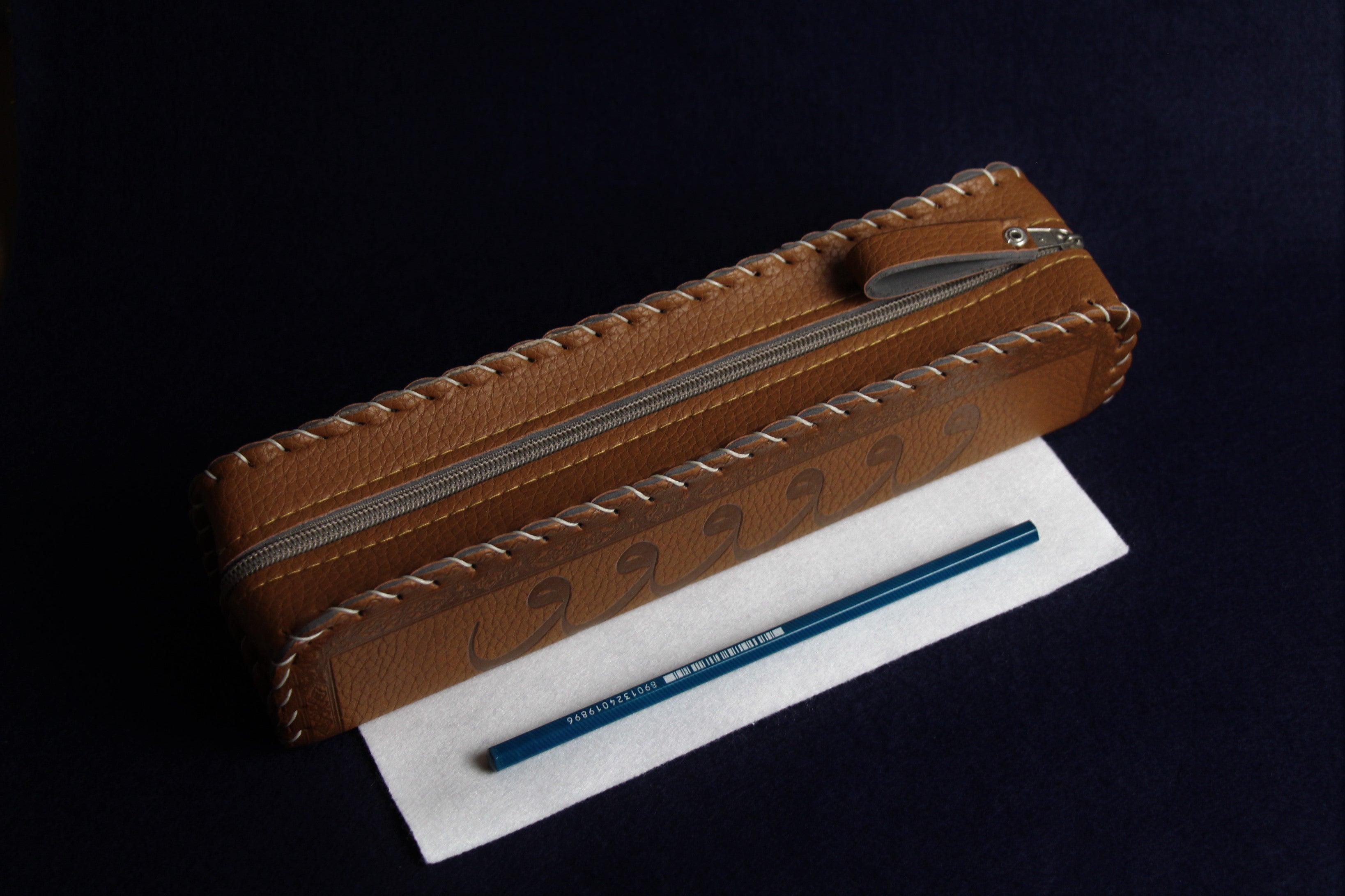 Faux leather case decorated with Arabic calligraphy - brown