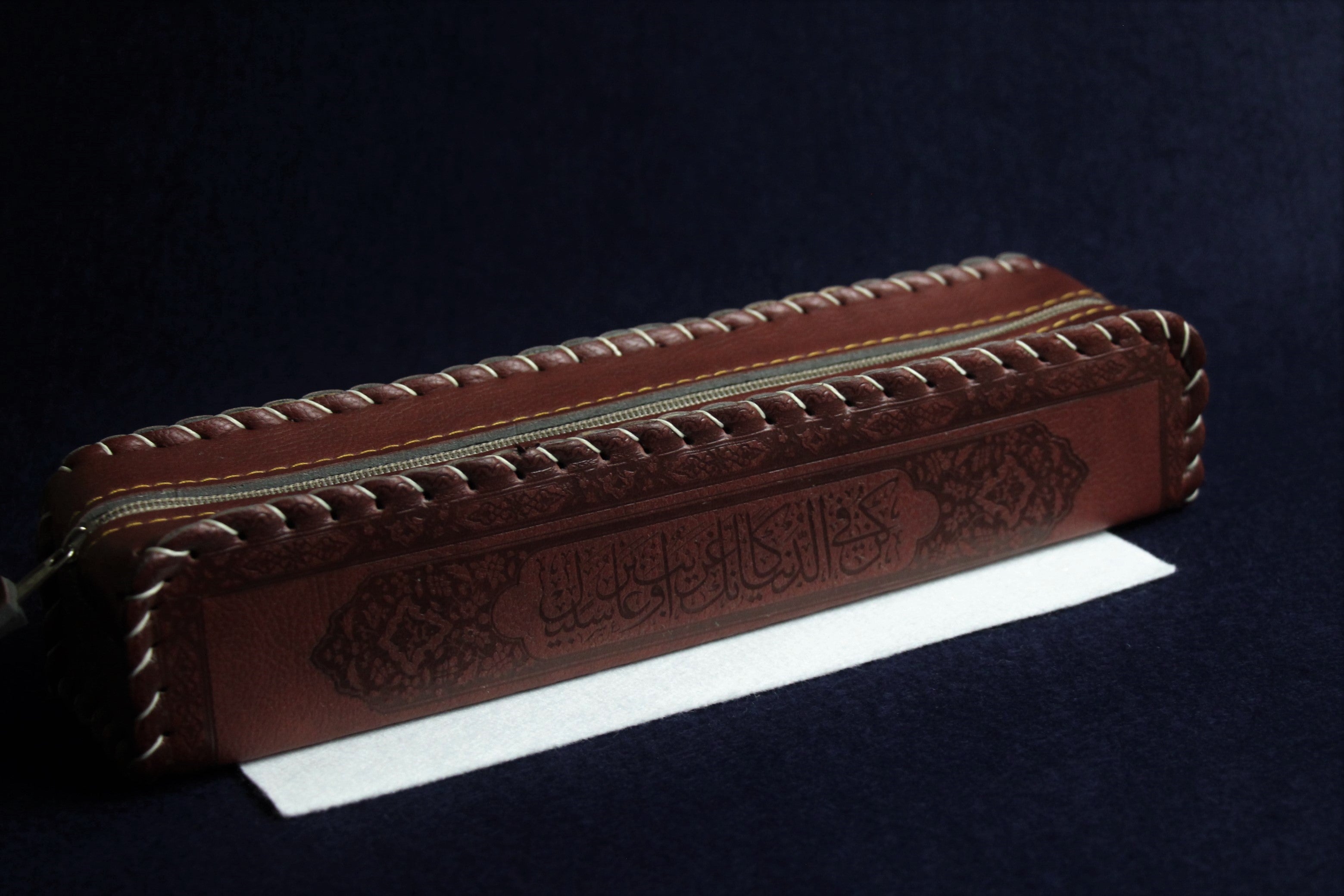 Faux leather case decorated with Arabic calligraphy - purple brown