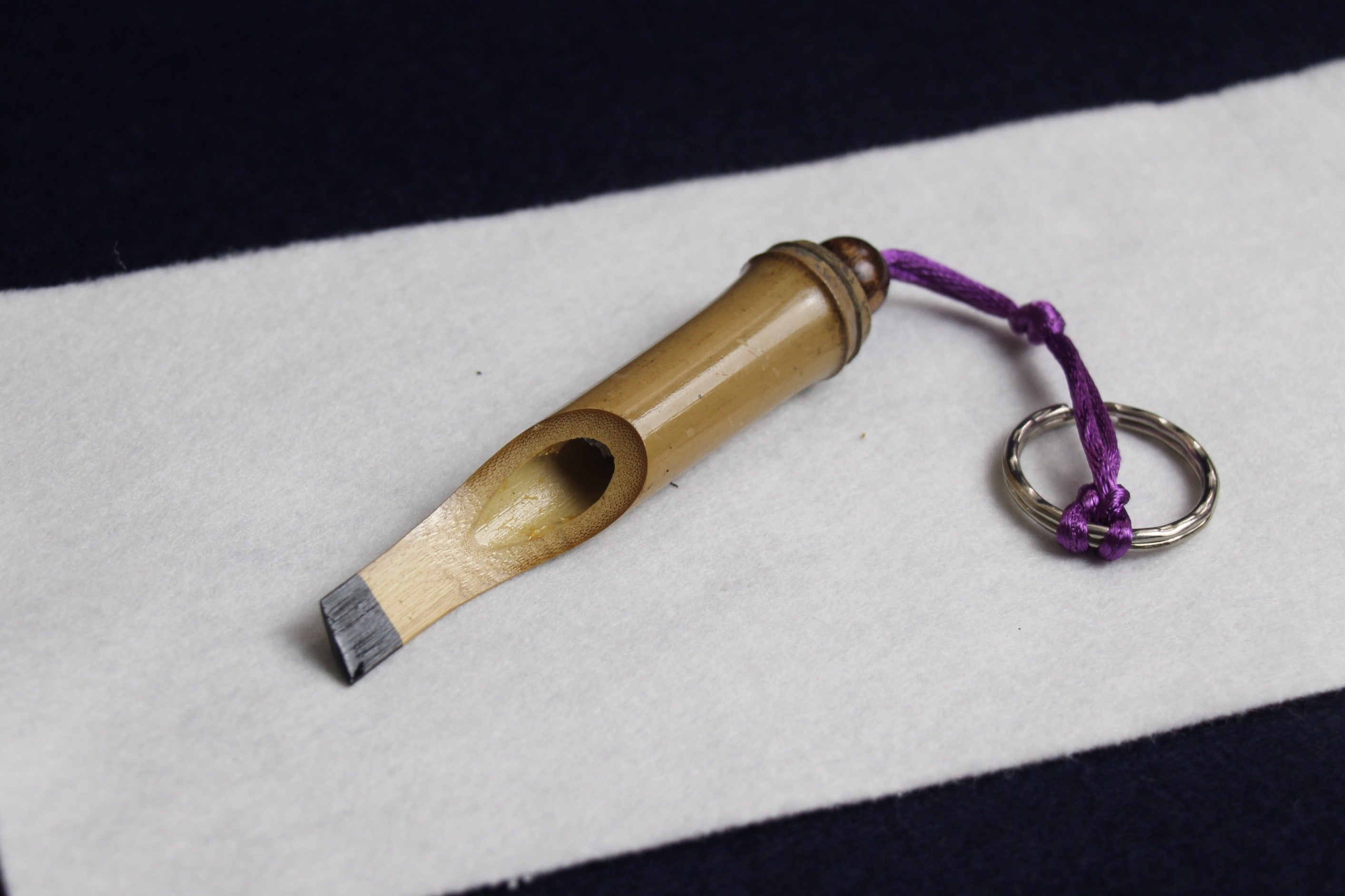 Bamboo keyring in shape of Arabic calligraphy qalam pen